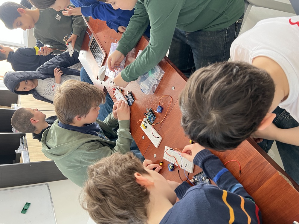Students wiring Arduino circuits together