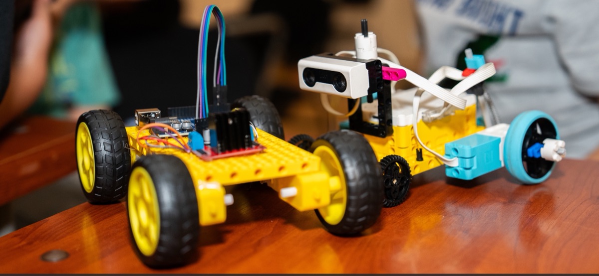 Robots built by students: an Arduino car and a LEGO robot